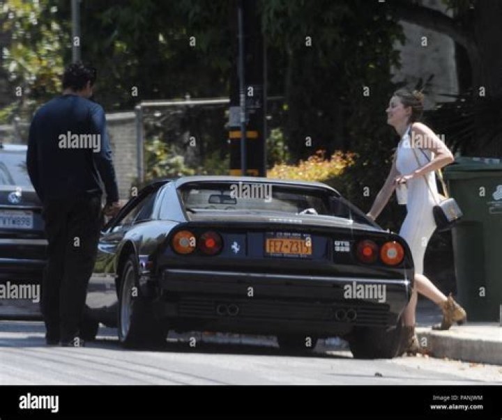 bitchy | Amber Heard and Vito Schnabel arrive for lunch date at Nobu in his classic Ferrari