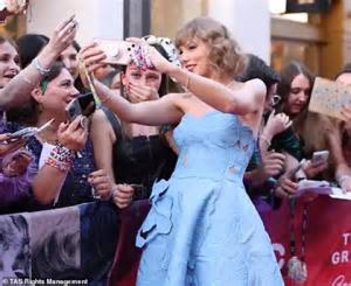 bitchy | Taylor Swift greets a large crowd of fans as she leaves Radio NRJ