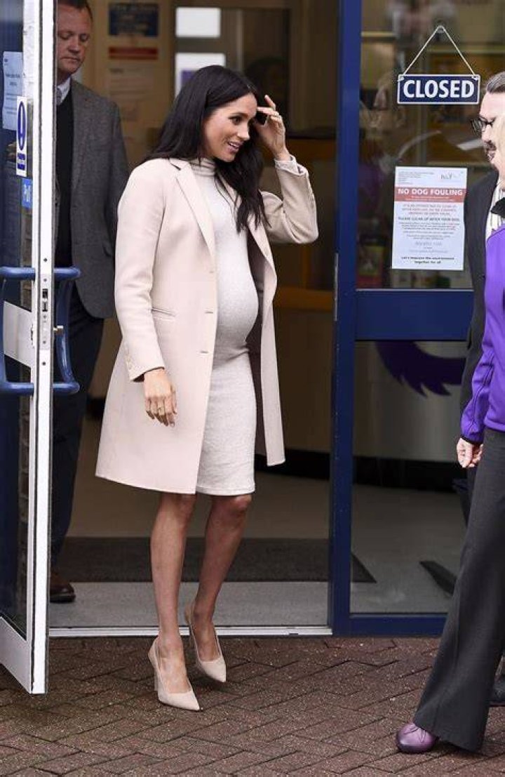	Duchess Meghan wore H&M, custom Armani to her first official visit to Mayhew	