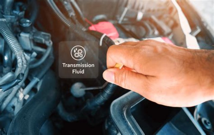 How do you check the transmission fluid in a Dodge Grand Caravan?