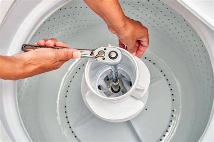 How do you fix a loose agitator on a Whirlpool washer?