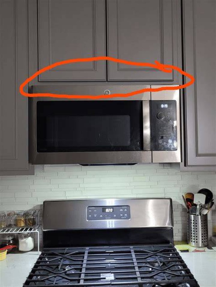 How do you remove grease from outside of microwave?