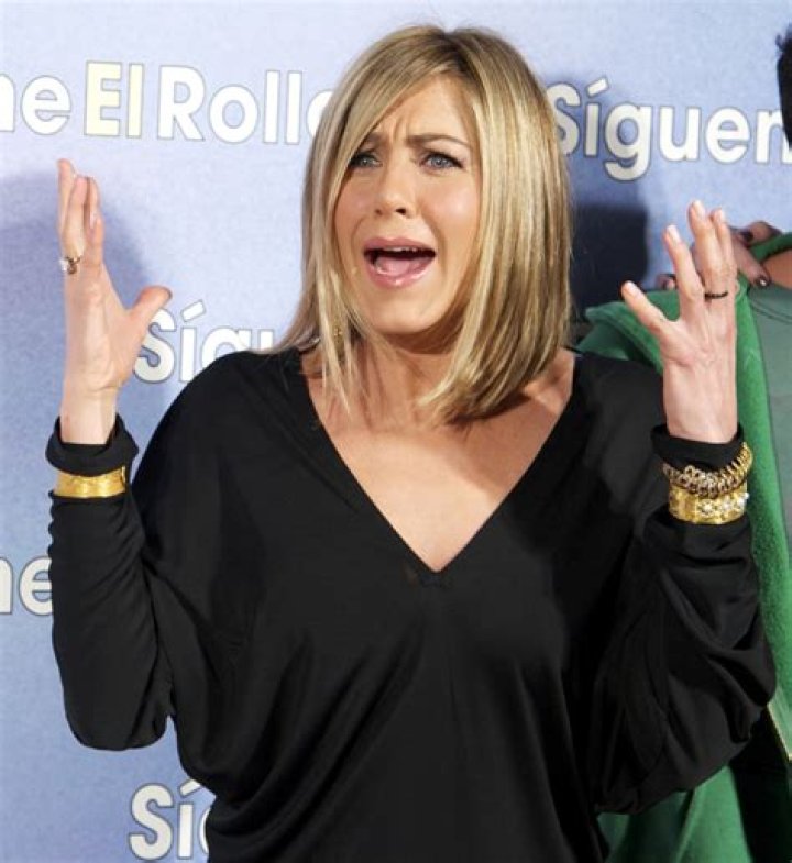 Jennifer Aniston covers Red Mag, jokes about having George Clooney’s babies